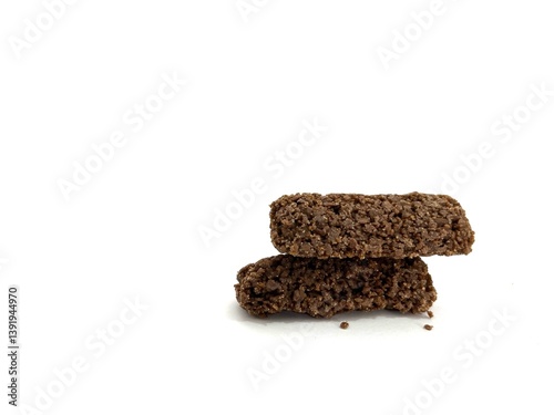Crispy chocolate oat snack bars with rough texture, healthy and crunchy, isolated on white background. Perfect for food advertising, packaging, and healthy lifestyle concepts