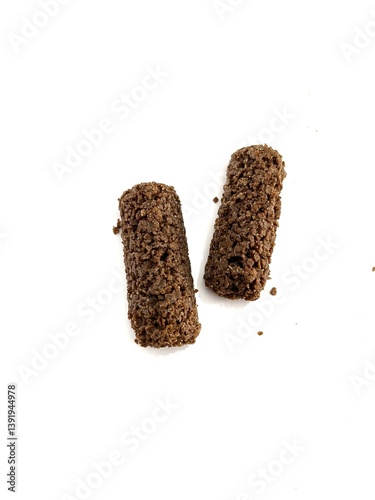 Crispy chocolate oat snack bars with rough texture, healthy and crunchy, isolated on white background. Perfect for food advertising, packaging, and healthy lifestyle concepts