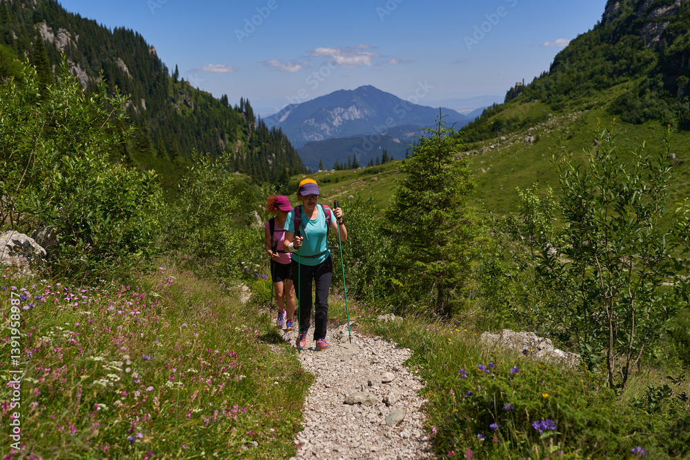 Women hiking toward forested mountain........4o..