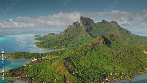 Obraz na płótnie Capturing breathtaking aerial views of Bora Bora, featuring iconic mount Otemanu, lush green slopes, and crystal-clear turquoise lagoon waters w salonie