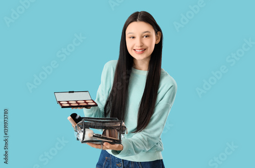 Teenage girl with cosmetic ...