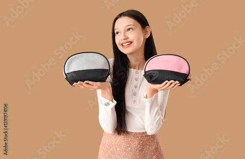 Teenage girl with cosmetic ...