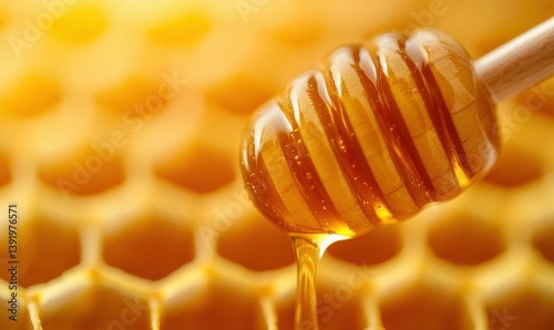 Golden honey slowly drips from a wooden dipper onto a honeycomb background, showcasing the pure, sweet delicacy.