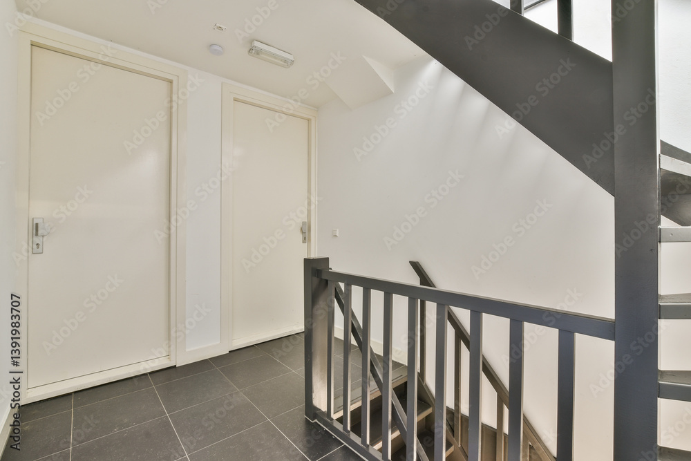 Obraz premium A sleek and minimalistic view of a modern staircase featuring clean lines and a contemporary aesthetic, ideal for showcasing interior architectural design.