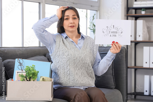 Fired businesswoman holding...