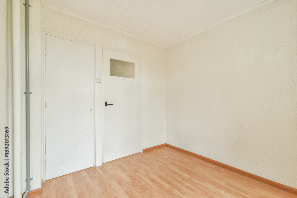 A minimalist interior of an empty room featuring plain white walls and wooden flooring, suggesting a tranquil space ready for personalization. A minimalist interior of an empty room featuring plain white walls and wooden flooring, suggesting a tranquil space ready for personalization.
