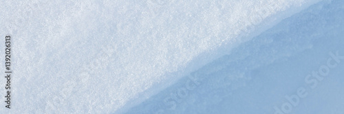 Obraz na płótnie Beautiful winter background with snowy ground. Natural snow texture. Wind sculpted patterns on snow surface. Wide panoramic texture for background and design. Closeup top view with copy space. w salonie