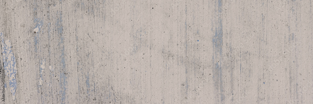 Vintage wall texture. The weathered, rough surface of a plastered concrete wall with faded paint. Wide panoramic texture for background and design.