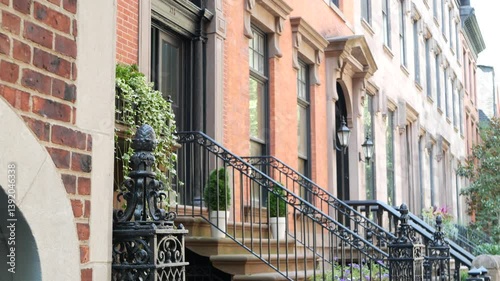 New York City townhouse building, Brooklyn Heights residential district, USA. Brownstone urban architecture, attached house. United States real estate, american property, apartments and homes in NYC.