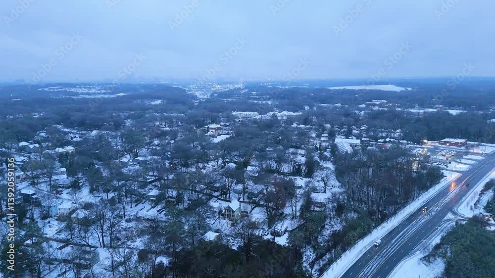 Aerial shot pushing in on snow covered homes in the suburbs of Atlanta Georgia on January 10 2025. Aerial shot pushing in on snow covered homes in the suburbs of Atlanta Georgia on January 10 2025.