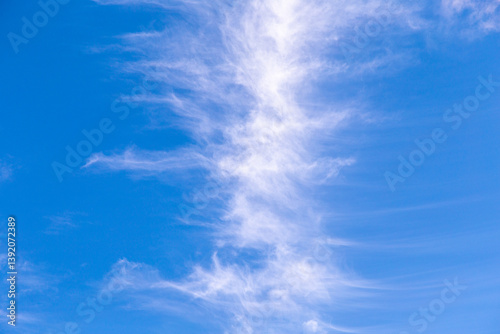 Photography puffy soft clouds in harmonic vertical structure at sky