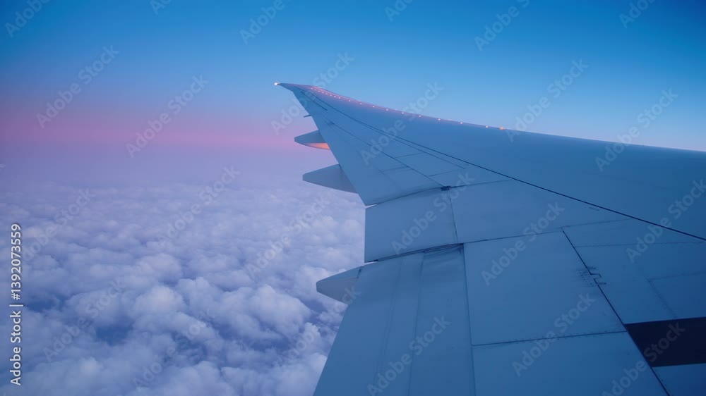 A breathtaking view from an airplane window, showcasing the magnificent and expansive sky along with fluffy clouds during flight at both sunrise and sunset, evoking a sense of wonder and tranquility A breathtaking view from an airplane window, showcasing the magnificent and expansive sky along with fluffy clouds during flight at both sunrise and sunset, evoking a sense of wonder and tranquility