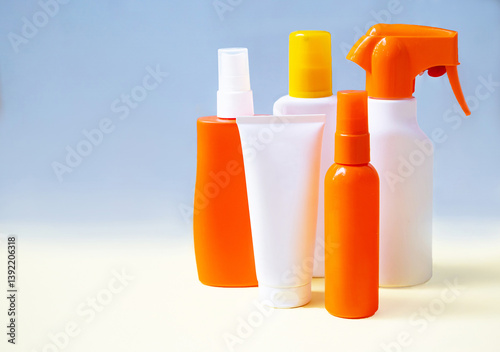 Group of different sunscreen (sun cream) bottles, tubes. Sun tan, summer skin care, photoaging, skin health, UV protection. Copy space, mock up.  Empty place.