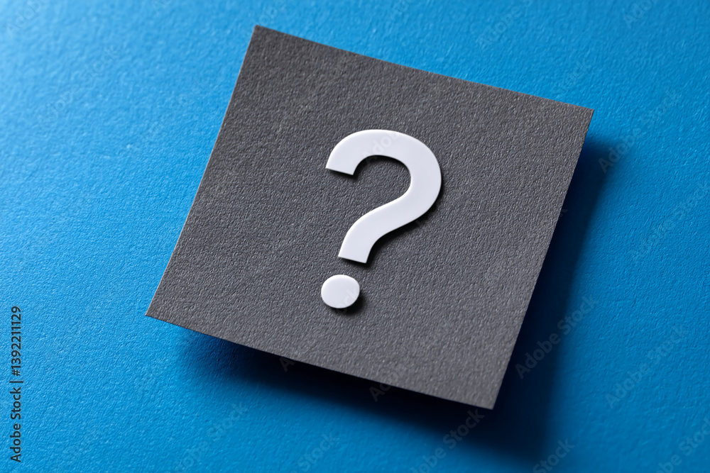Gray square card on blue background, featuring a white question mark, suggesting inquiry, doubt, or a need for information, suitable for concepts related to questions and answers Gray square card on blue background, featuring a white question mark, suggesting inquiry, doubt, or a need for information, suitable for concepts related to questions and answers