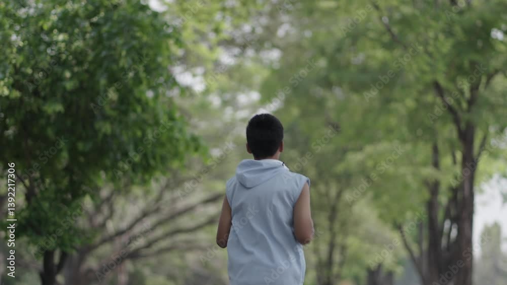 A boy is exercising in the garden and is refreshed. A boy is exercising in the garden and is refreshed.