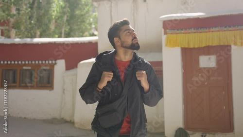 4K footage of a solitary man walking through the grand halls of a Ladakh monastery, evoking a sense of reflection and peace.