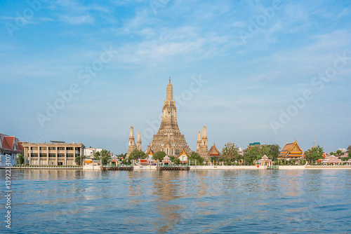 Photography Beautiful of Buddhist temple or Wat Arun Ratchawararam Ratchawaramahawihan with famous tourist landmark sunlight in the morning, Bangkok, Thailand