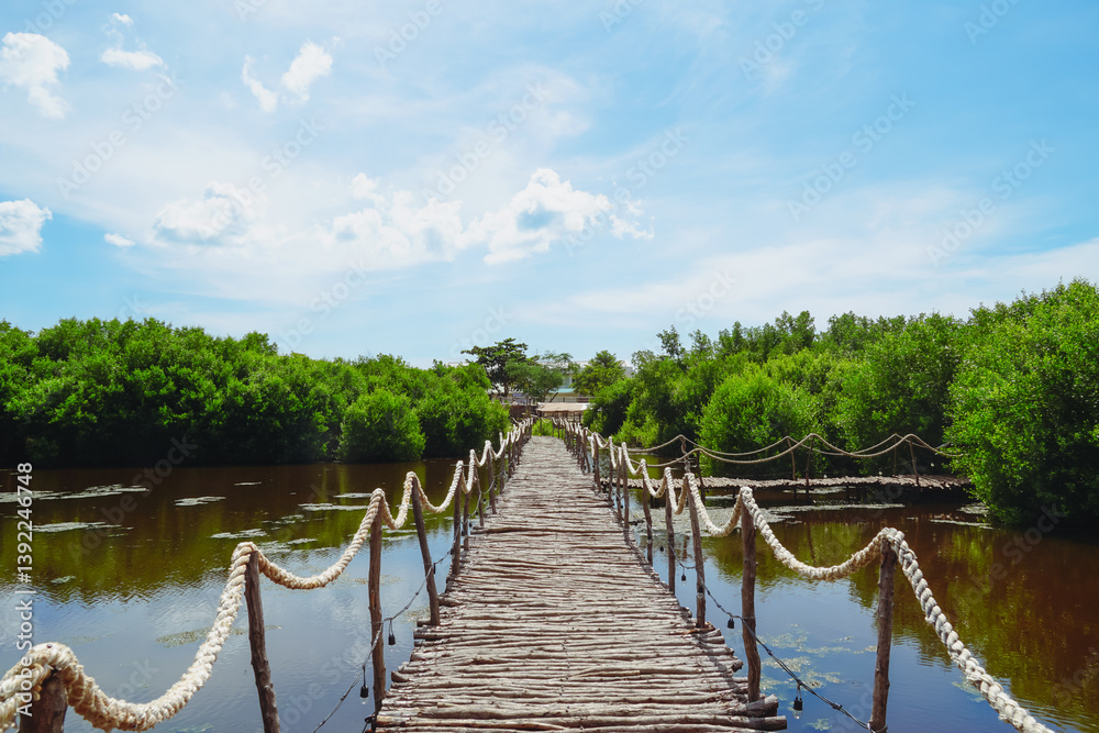 Obraz premium Wooden pier or bridge at Sattahip, Thailand. A walkway bridge made of wooden planks and leading.