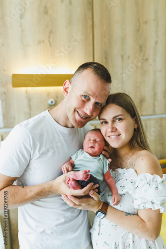 Obraz na płótnie New Family Bliss Embracing, Cherishing, and Celebrating the Precious Moments Spent with a Beautiful Newborn Baby at Home, Creating Lasting Memories Together in a Warm and Loving Environment w salonie