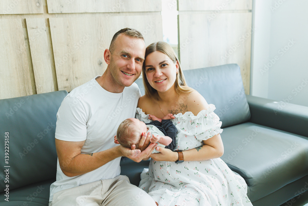 New parents treasure and cherish the precious moments they share with their adorable newborn baby in a beautifully bright and modern living space filled with love and joy, creating lasting memories