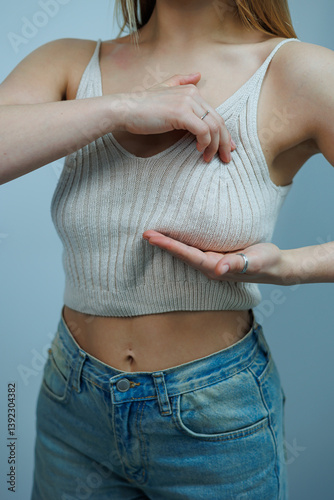 Examination of the mammary gland. A woman at a mammologist's appointment. Women's health care