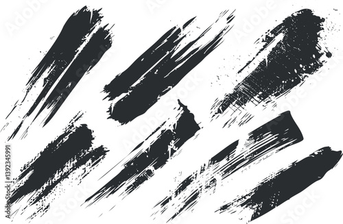 Abstract black brush strokes on white background, perfect for artistic designs and textures.