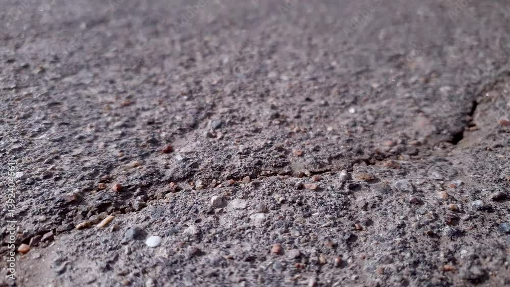 Cracked stone-concrete pavement, road, crevice, earthquake, landslide. Cracked stone-concrete pavement, road, crevice, earthquake, landslide.