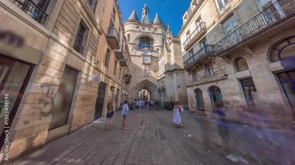 Porte Saint Eloi timelapse hyperlapse, also called Grosse Cloche, is a medieval gothic gate in Bordeaux, France. A symbol of the city's history with a big bell and clock. Blue sky enhances its beauty