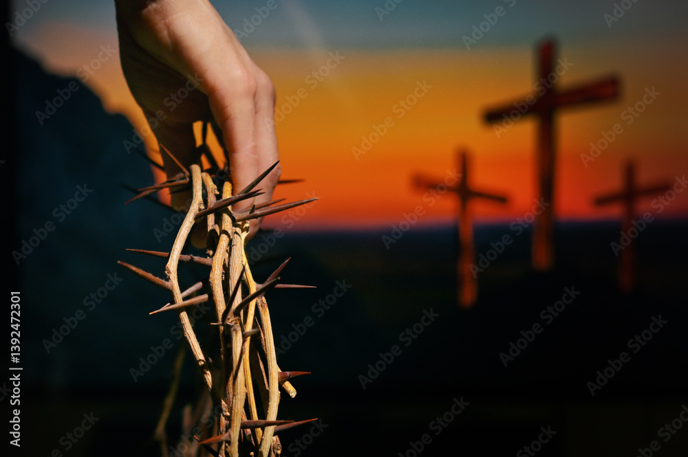 Hand holding crown of thorns andThree Crosses On Calvary Hill
