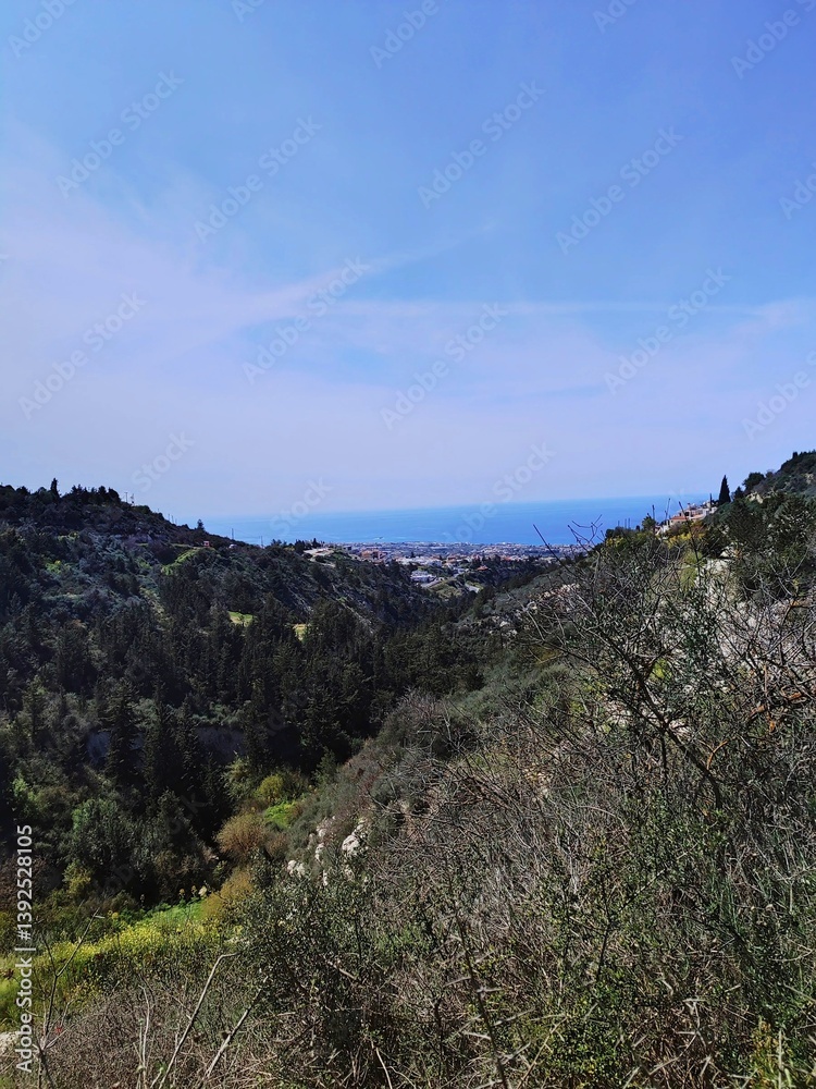 Panoramic view of lush hills and coastline along a clear day in the Mediterranean region Panoramic view of lush hills and coastline along a clear day in the Mediterranean region