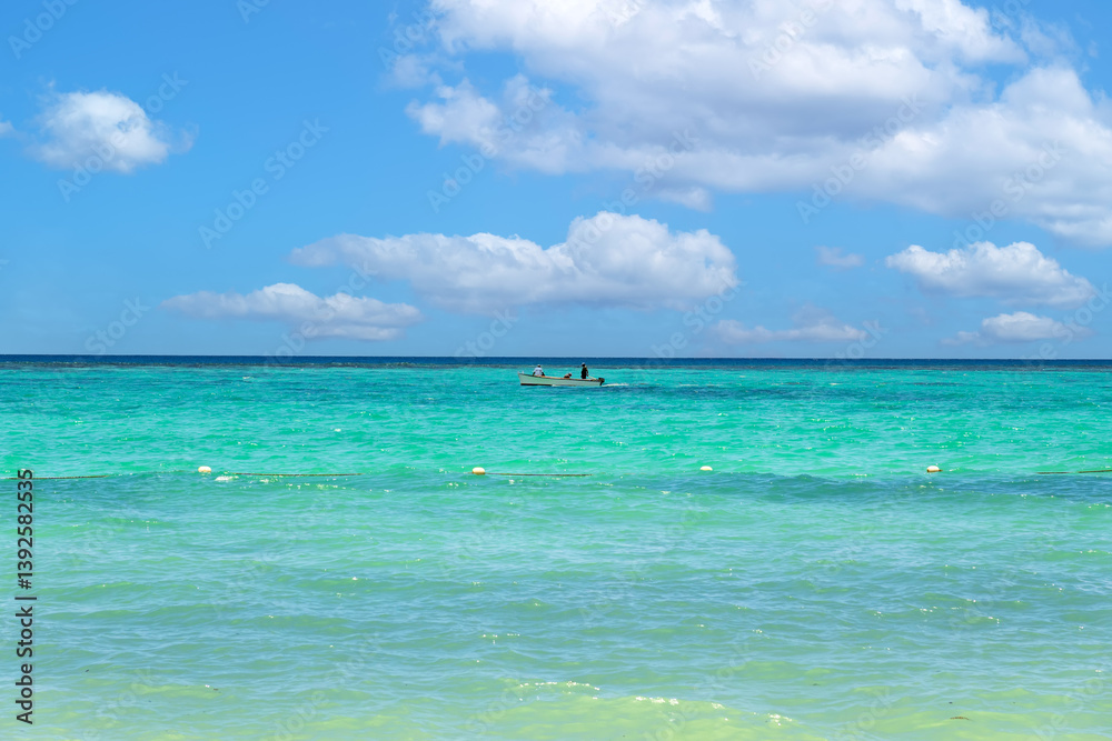 Solitary Boat on Crystal Clear Tropical Ocean with Vibrant Aquamarine Gradient.Lone Fishermen on Calm Turquoise Sea Under Perfect Sky. Solitary Boat on Crystal Clear Tropical Ocean with Vibrant Aquamarine Gradient.Lone Fishermen on Calm Turquoise Sea Under Perfect Sky.