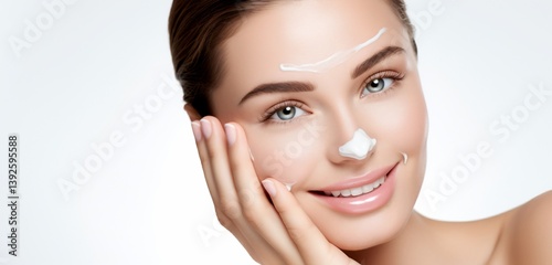 Woman's face with facial cream