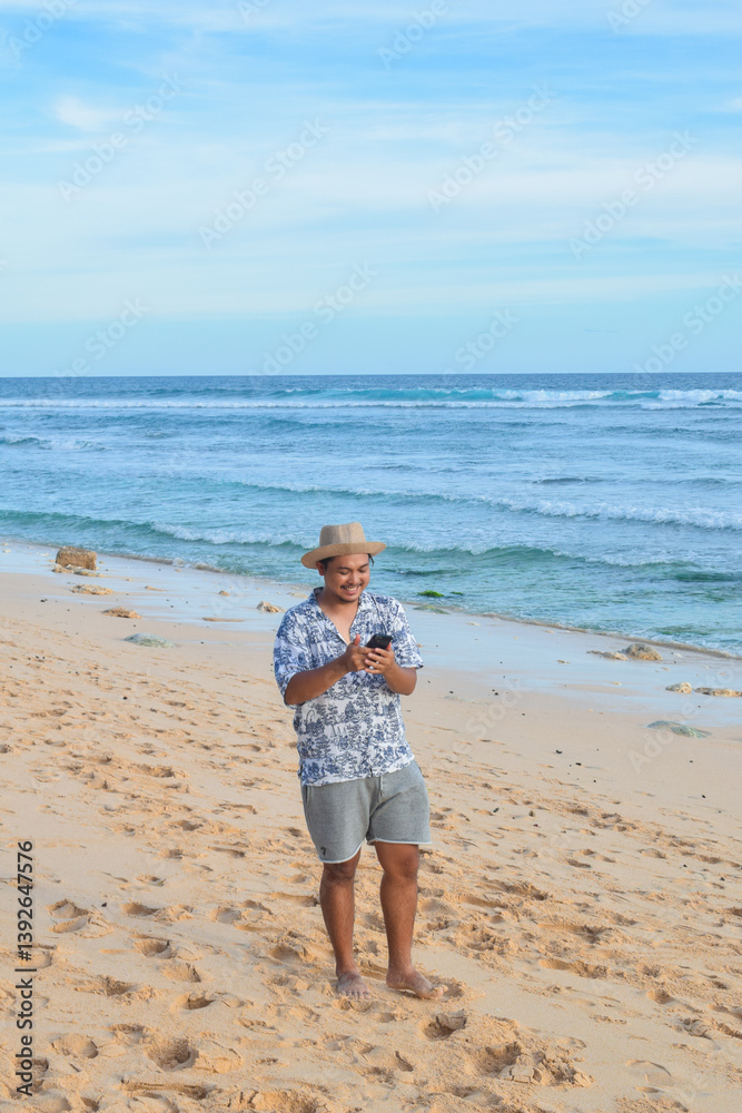 A happy southeast asian traveller at the beach A happy southeast asian traveller at the beach