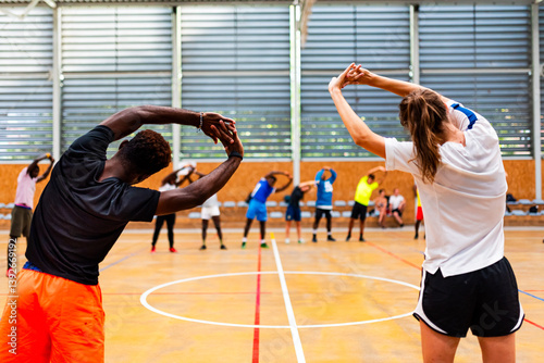 Group of mixed race boys and young men training in indoor soccer. Concept of sport and team of black and african people.