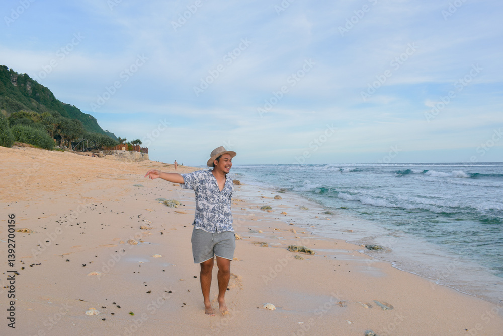 A happy southeast asian traveller at the beach A happy southeast asian traveller at the beach
