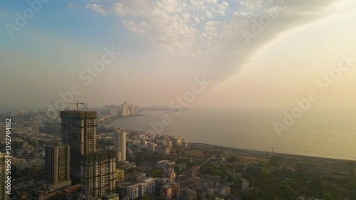 Beautiful sunset with dramatic clouds at Marinedrive, Mumbai