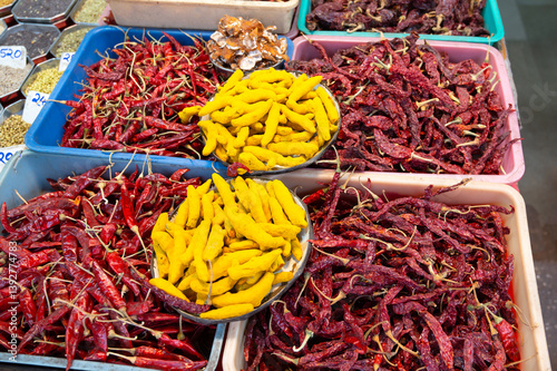 Fototapeta Naklejka Na Ścianę i Meble -  Turmeric and red chilli spices for sale on a spice market in Mumbai, India, fresh ingredients for cooking indian food