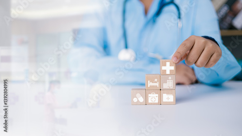 Foto Health insurance concept, Access to welfare health concept, Doctor holding a wooden block with plus and medical icons on hospital background, Eligibility for treatment in the health insurance system