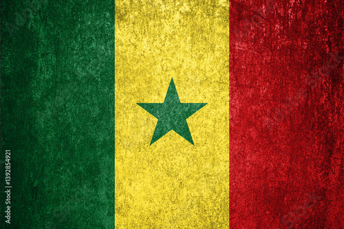 Senegal State Flag. Dirty Senegal flag on metal surface.