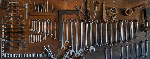 wooden tool board with structured mechanic tools in workshop