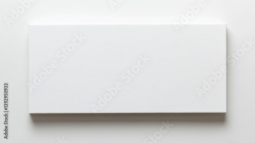 Obraz na płótnie Blank white canvas on a white surface, ideal for painting or mockup purpose w salonie