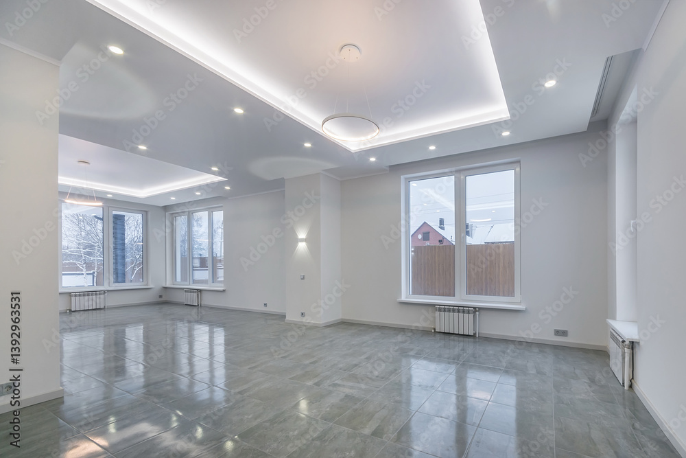 An empty room of a country house with a fine finish. Windows with a view of the winter landscape. An empty room of a country house with a fine finish. Windows with a view of the winter landscape.