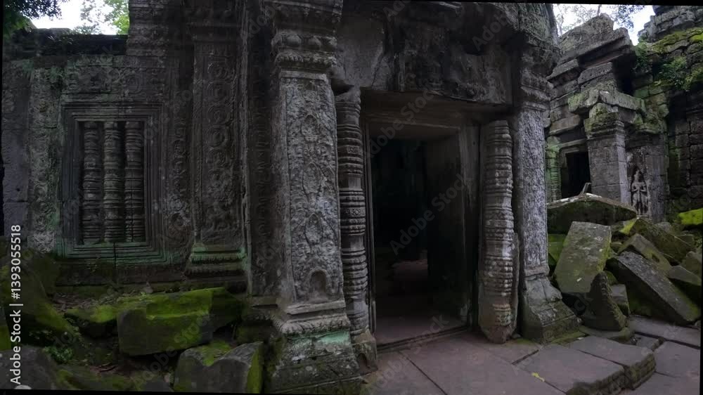 The image depicts moss-covered ruins being overtaken by large tree roots, reflecting the powerful growth of nature in an ancient, overgrown structure. Banteay Kdei Temple
The image depicts moss-covered ruins being overtaken by large tree roots, reflecting the powerful growth of nature in an ancient, overgrown structure. Banteay Kdei Temple