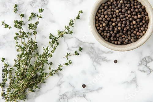 Flat Lay of Thyme and Peppercorns on White Marble Kitchen Counter