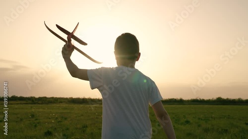 boy son child running airplane game flight dream playground green field sunset pilot, son airplay fun, dreamy sunset aviator, outdoor games sunset, playtime at dusk, young boy airplane passion