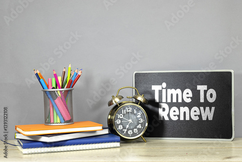 Time to Renew Inspiration Concept with Alarm Clock and Colorful Stationery