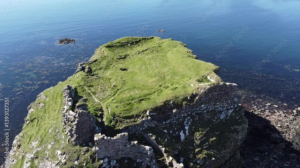 Aerial 360 of Dun Scaith ruins near TOKAVAIG Isle of Skye, Scotland