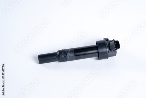 Car ignition coil on white background. Element of car engine.