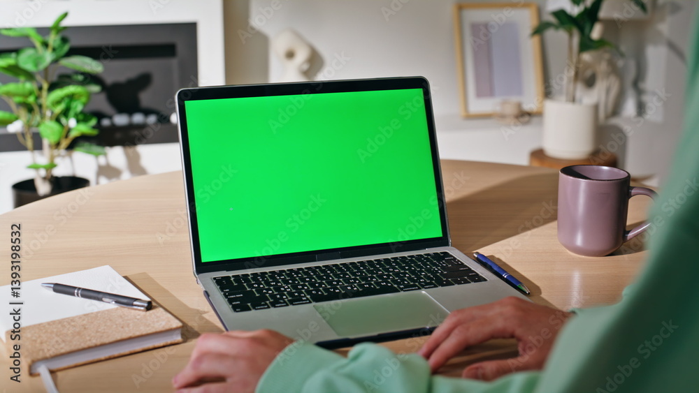 Online student studying chroma key laptop browsing webinar home closeup.