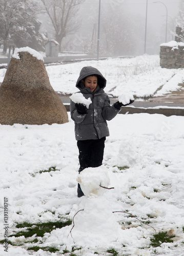 Child playing in the snow